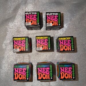 Eight NeeDoh Squishies Lot Assorted Colors
3 Colorwave, 3 Crunch & 2 Glitter